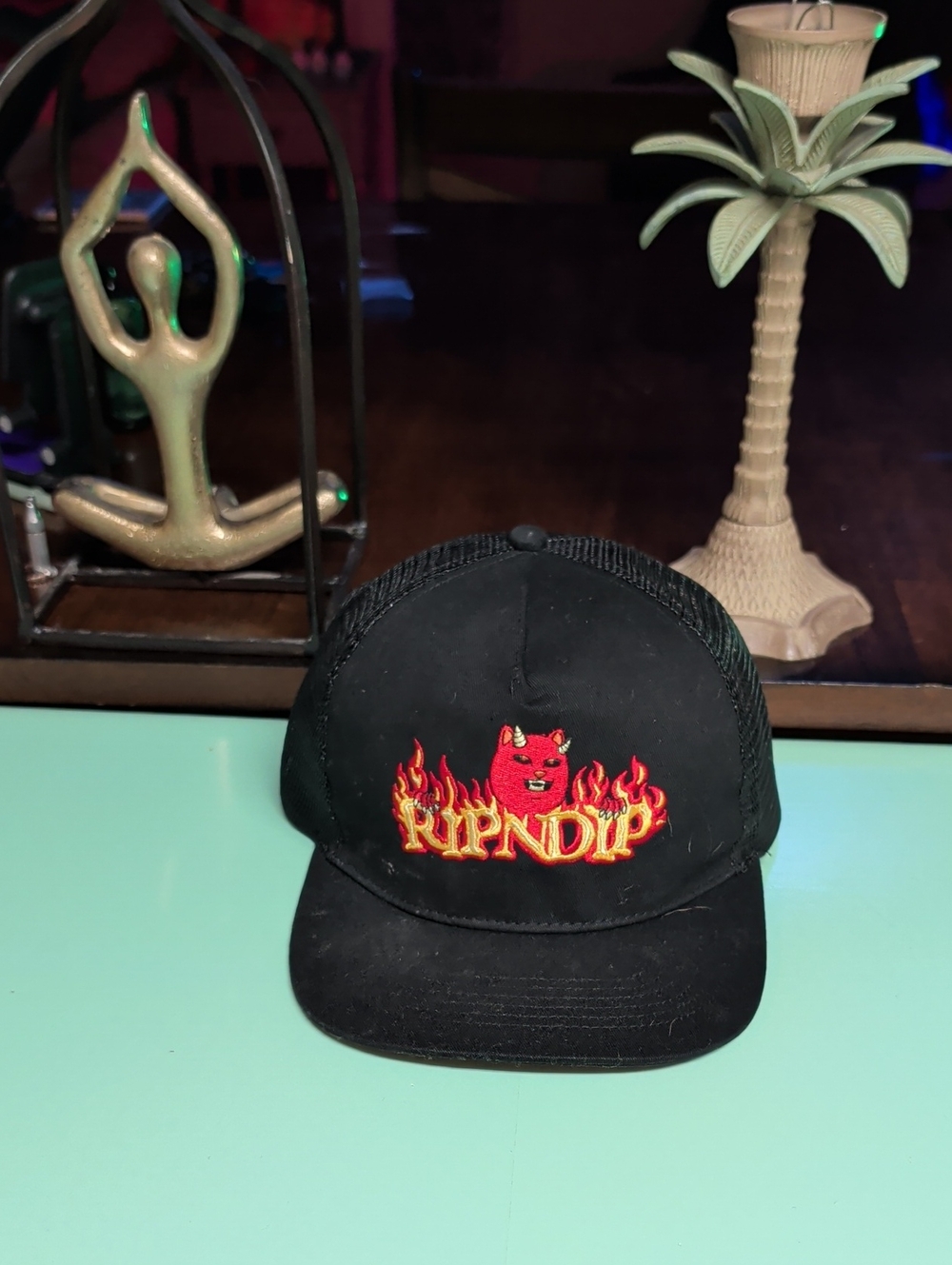 Ripndip Black Trucker Hat with Red Flame Logo